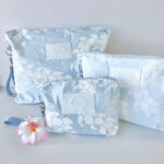 Puakenikeni Curvilinear Lei WRISTLET POUCH